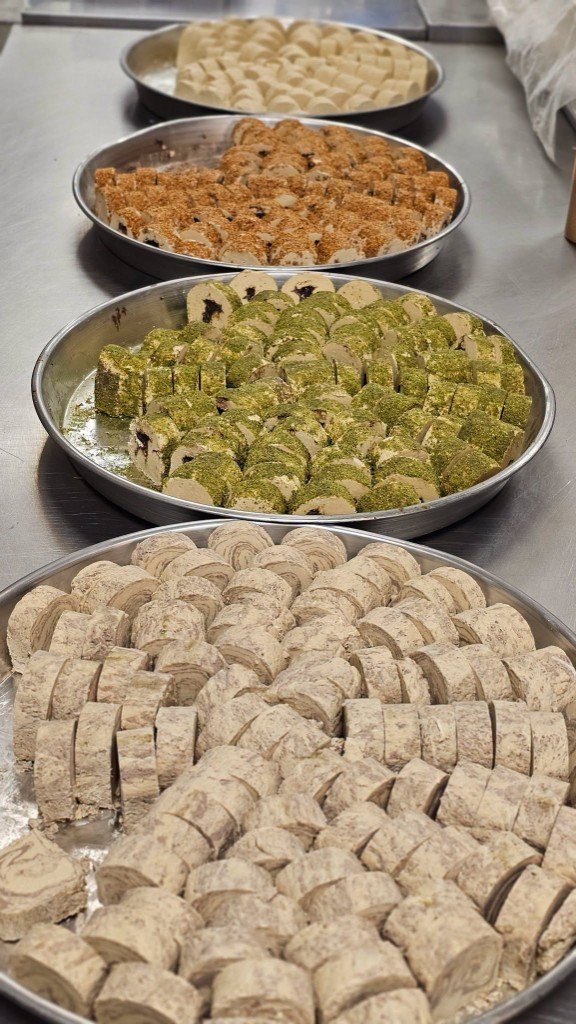 Trays of sweets prepared for catering at Al-Taj
