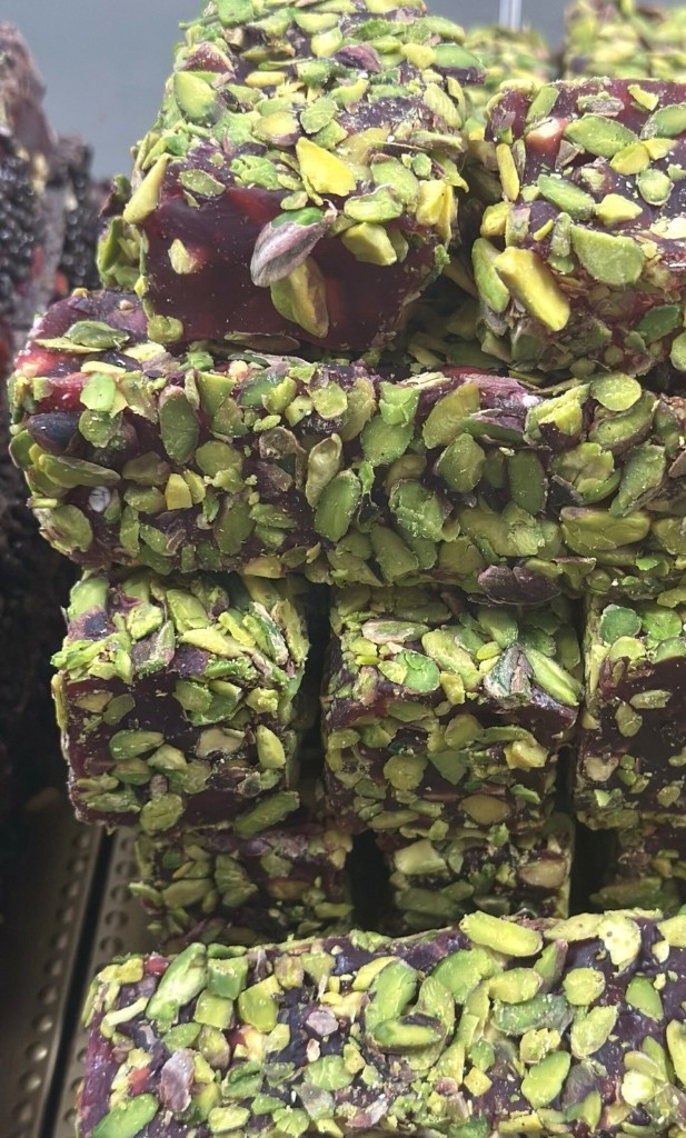 Pomegranate Turkish delight rolled in pistachio at Al-Taj
